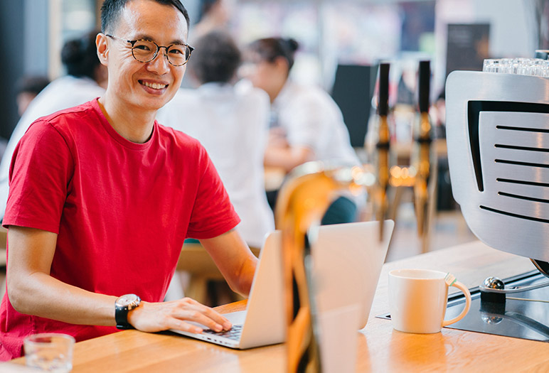 Vision 360 marketing team member working on his desk