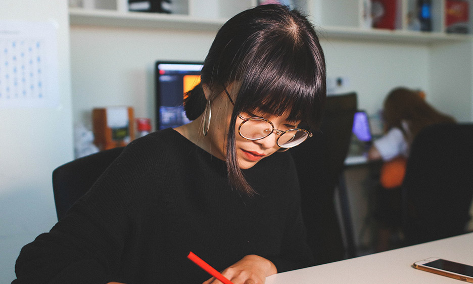 woman designing graphics for social media and websites